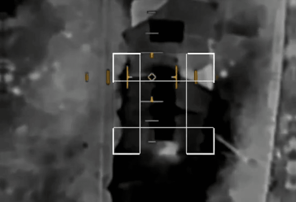 Footage of a First Person View (FPV) drone flying over a military target