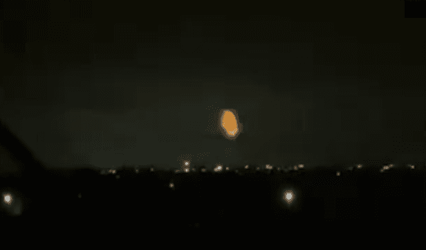 A bright explosion over a dark skyline of Russia's Slavyansk-on-Kuban