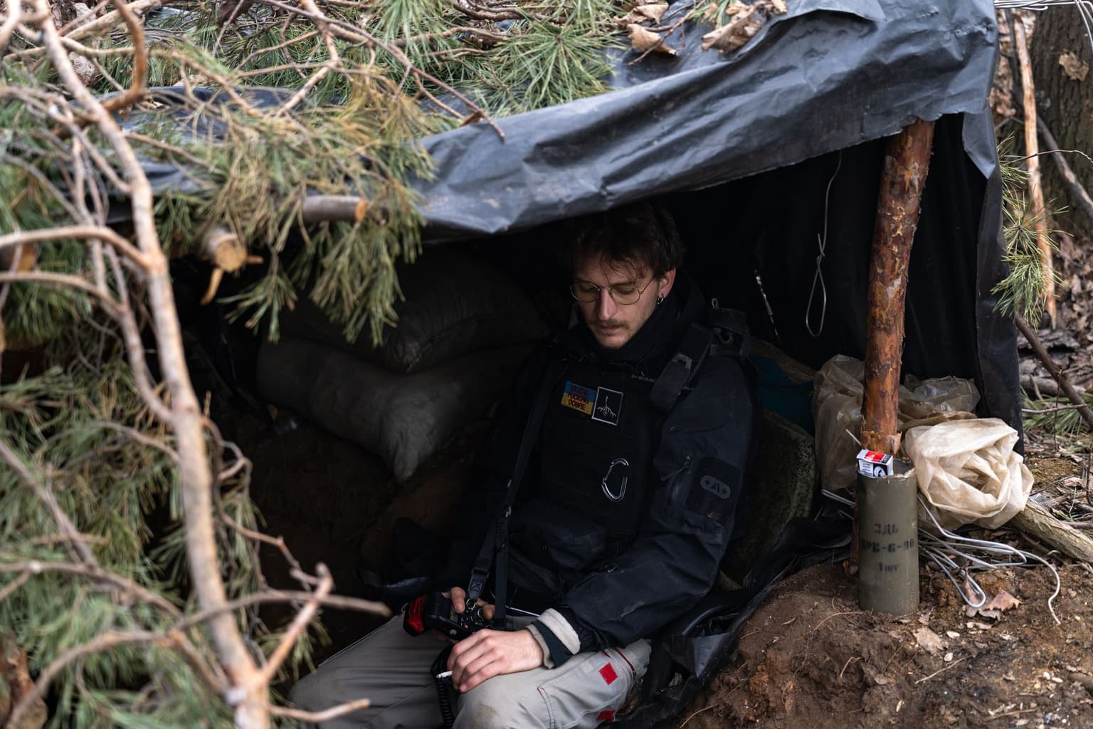 Ukrainian photojournalist George Ivanchenko in a dugout near Toretsk, Donetsk Oblast, Ukraine.