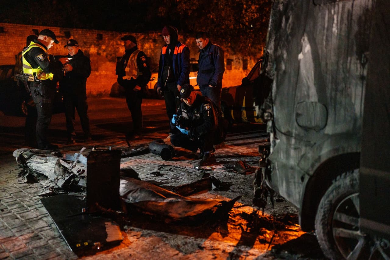 Russia attacks Kyiv as drone debris falls into residential area, sets cars ablaze