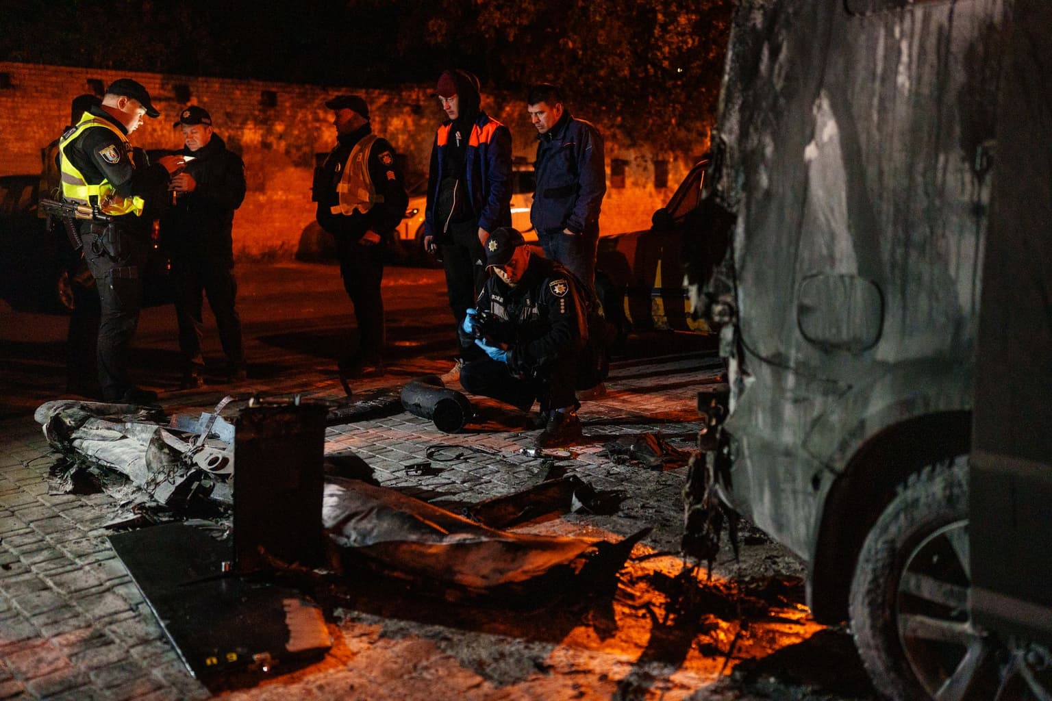 Russia attacks Kyiv as drone debris falls into residential area, sets cars ablaze