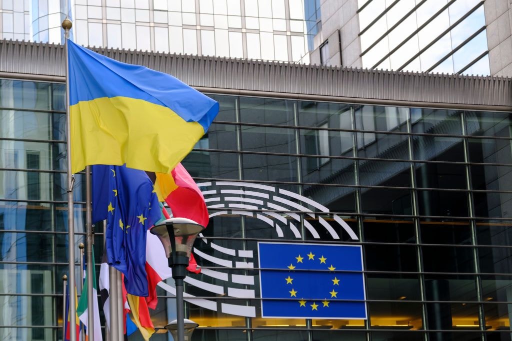 The EU and Ukrainian flags in front of the European Parliament in Brussels, Belgium, July 2023.