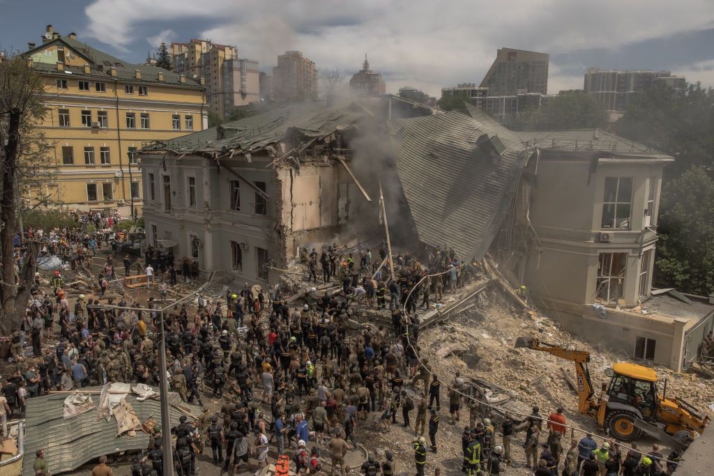 Emergency workers clear the rubble from the Okhmatdyt children's hospital, which was destroyed in a Russian missile attack.