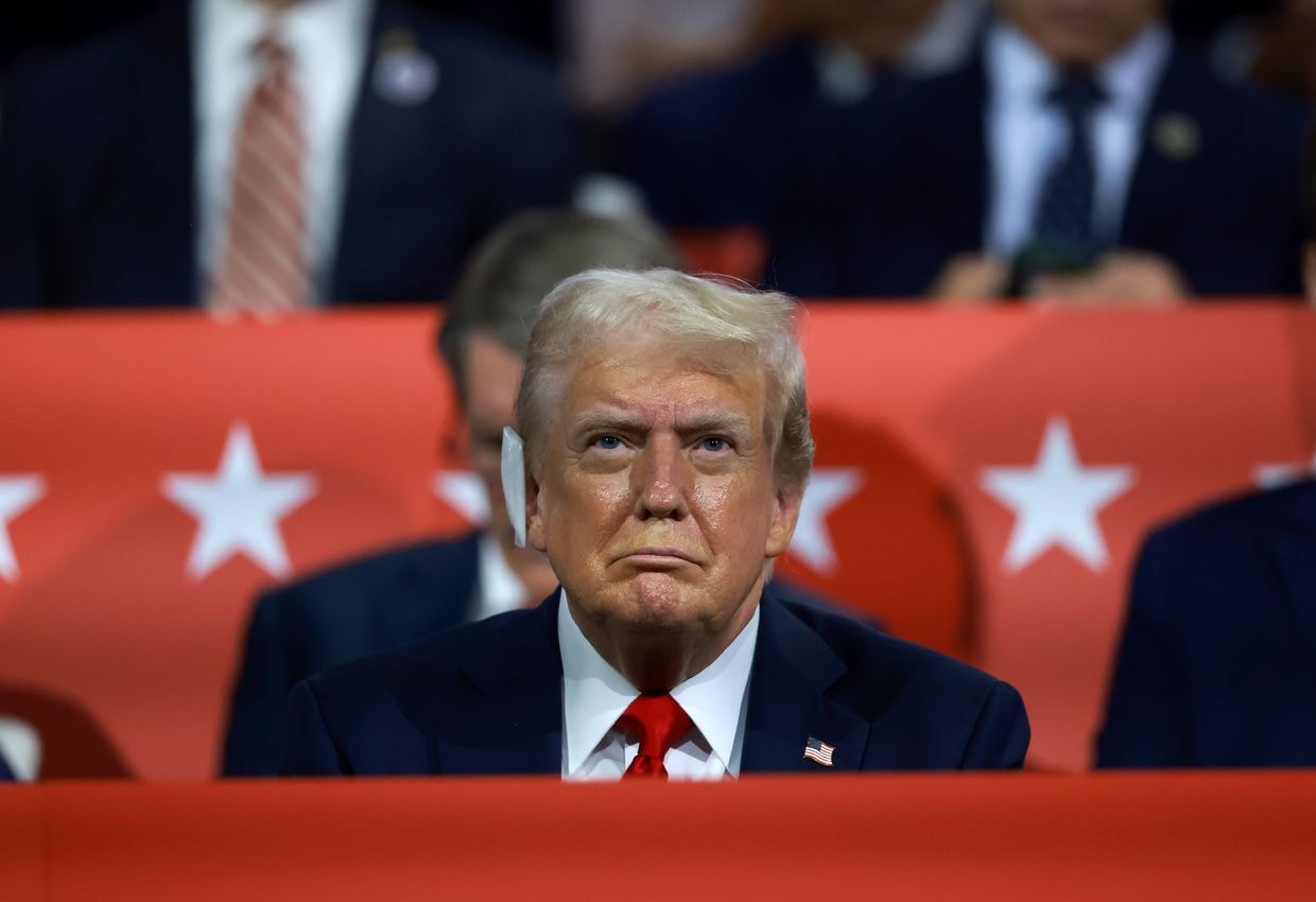 Republican presidential candidate, former U.S. President Donald Trump listens to speakers 