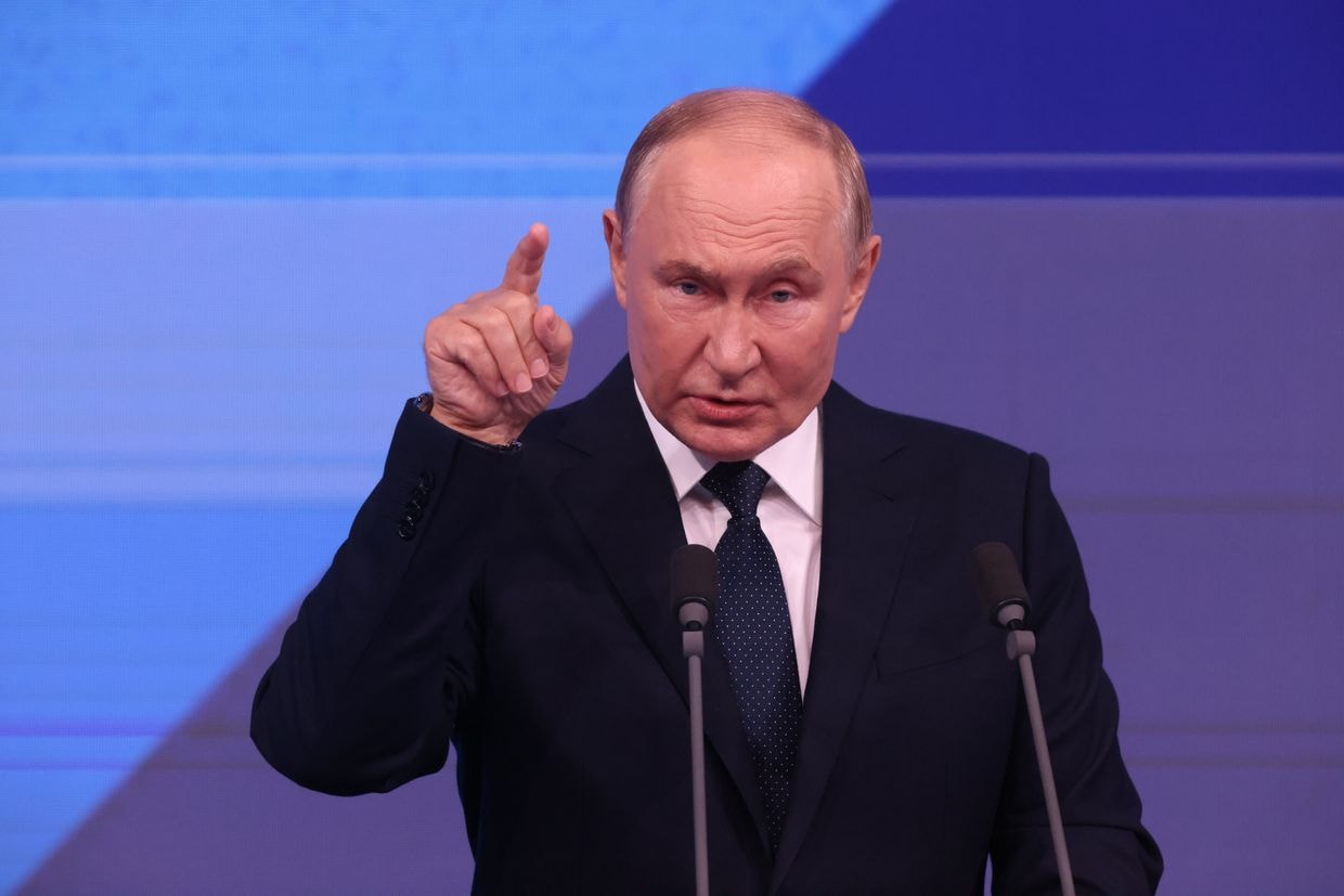 Russian President Vladimir Putin gestures during his speech at the meeting in Moscow, Russia