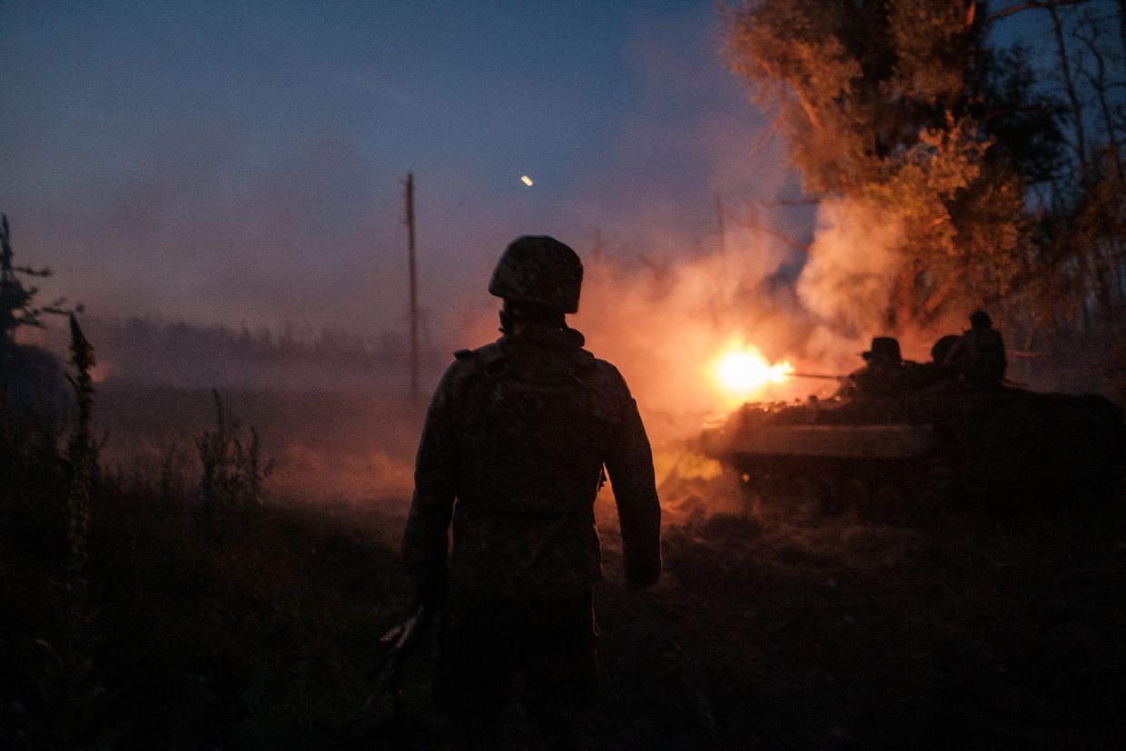 Ukrainian soldiers fire a tank as they carry out a mission to shoot at russian positions in Luhansk Oblast, Ukraine