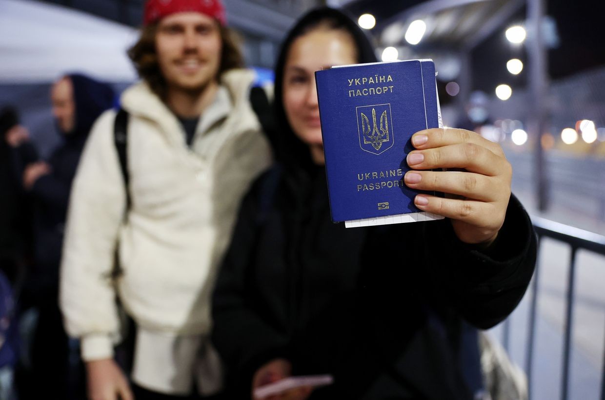 Photo for illustrative purposes: A Ukrainian woman displays her passport as she waits to cross the U.S.-Mexico border on April 5, 2022 in Tijuana, Mexico. (Mario Tama/Getty Images)