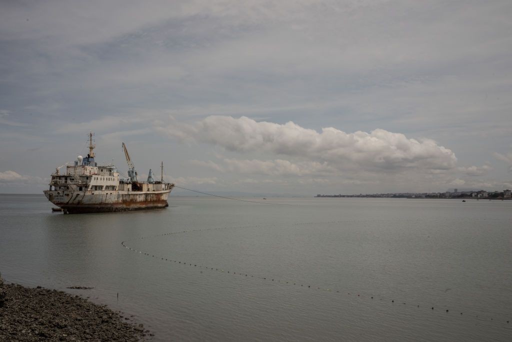 A ship leaves the harbor in Conakry, Guinea on Sept. 28, 2023