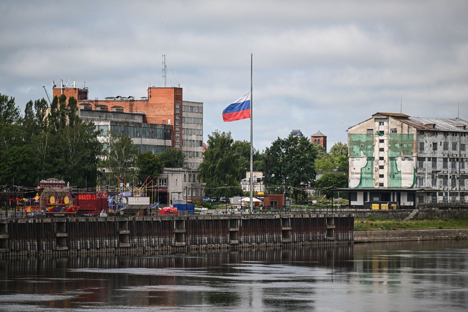 A Russian flag is seen from Pagegiai, Lithuania, separated by the river from the Kaliningrad Oblast, on July 10, 2023.