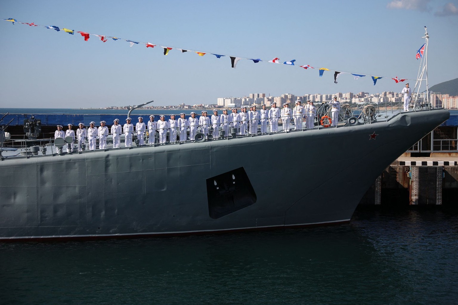Sailors stand at attention on the deck of a Russian Black Sea Fleet warship in Novorossiysk, Russia, on July 30, 2023.