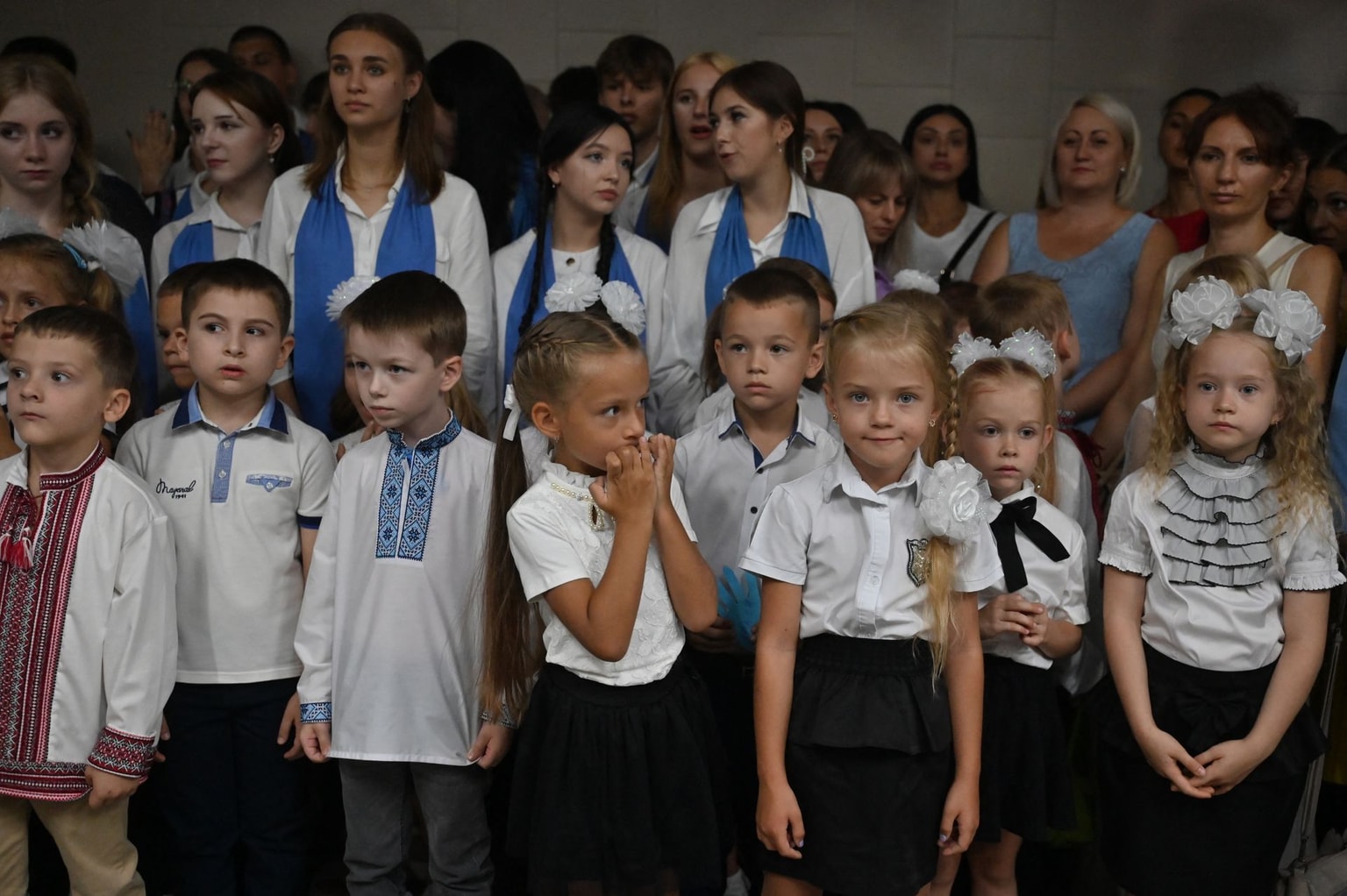 Pupils attend a ceremony held in a subway station shelter in Kharkiv, Ukraine, on Sept. 1, 2023.