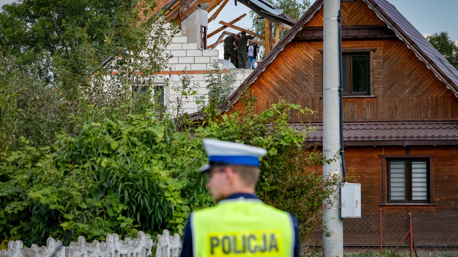 Police and army inspect the damage to a house in Wyryki-Wola, Poland, on Sept. 10, 2025.