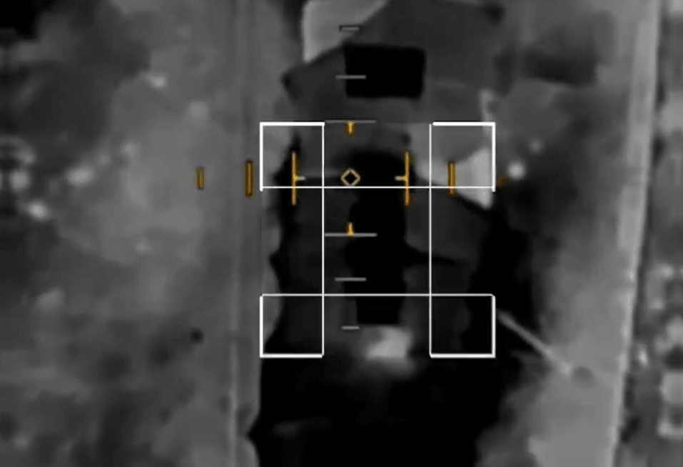 Footage of a First Person View (FPV) drone flying over a military target