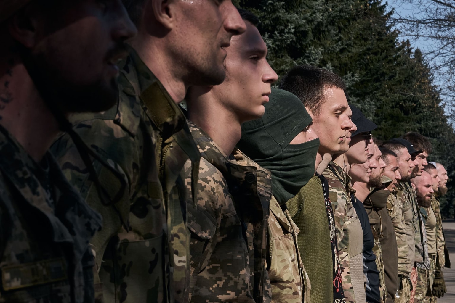 Young recruits undergo military training on an obstacle course at a recruiting center in Kyiv, Ukraine, on April 9, 2024. 