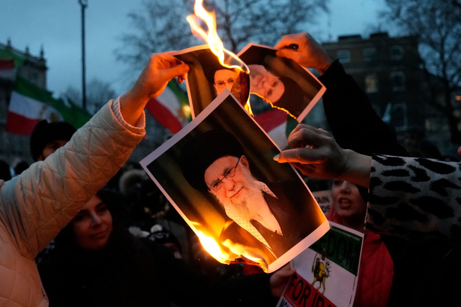 Protesters burn images of Iran’s Supreme Leader Ayatollah Ali Khamenei in central London, U.K., on Jan. 11, 2026. 