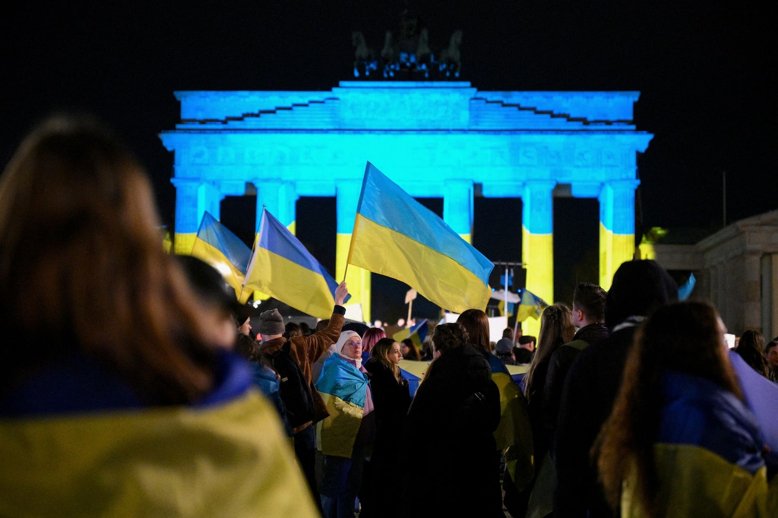 People take part in a pro-Ukraine demonstration in front of the Brandenburg Gate in Berlin, Germany, on Feb. 24, 2025.