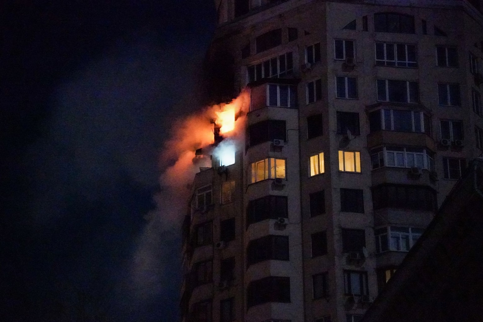 Fire engulfs an apartment building following a Russian air attack in Kyiv, Ukraine, early on Feb. 3, 2026. 