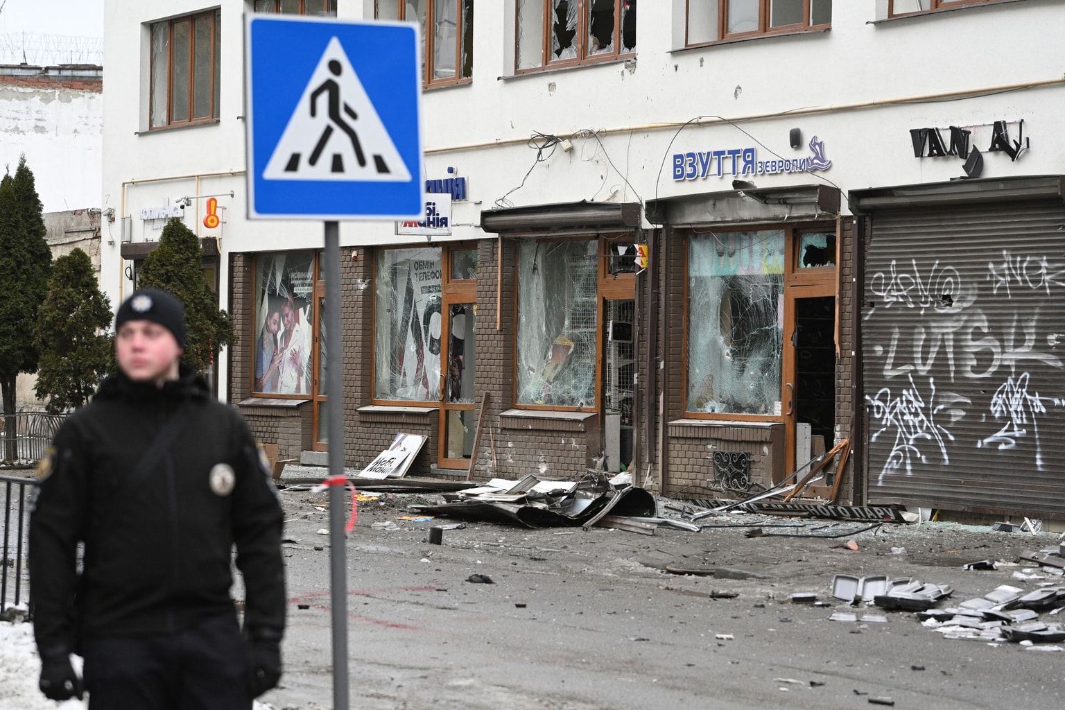 A Ukrainian police officer secures the area at the site of an explosion that struck Lviv, Ukraine, on Feb. 22, 2026