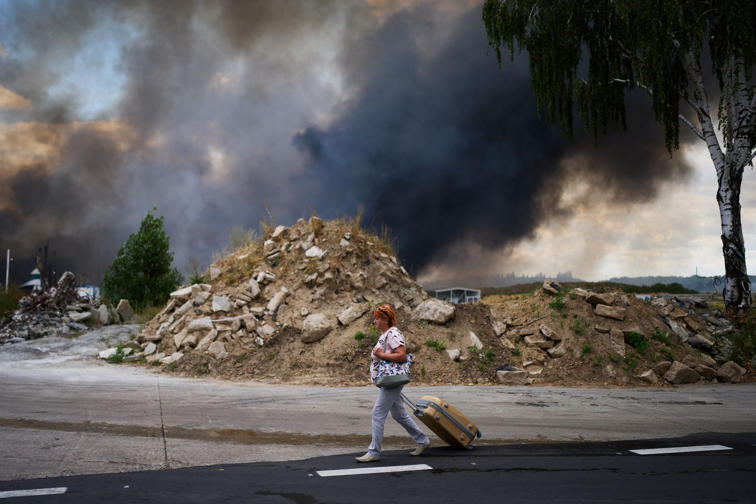 smoke rises from a destroyed warehouse after a Russian drone attack on the outskirts of Kyiv, Ukraine, on Aug. 27, 2026