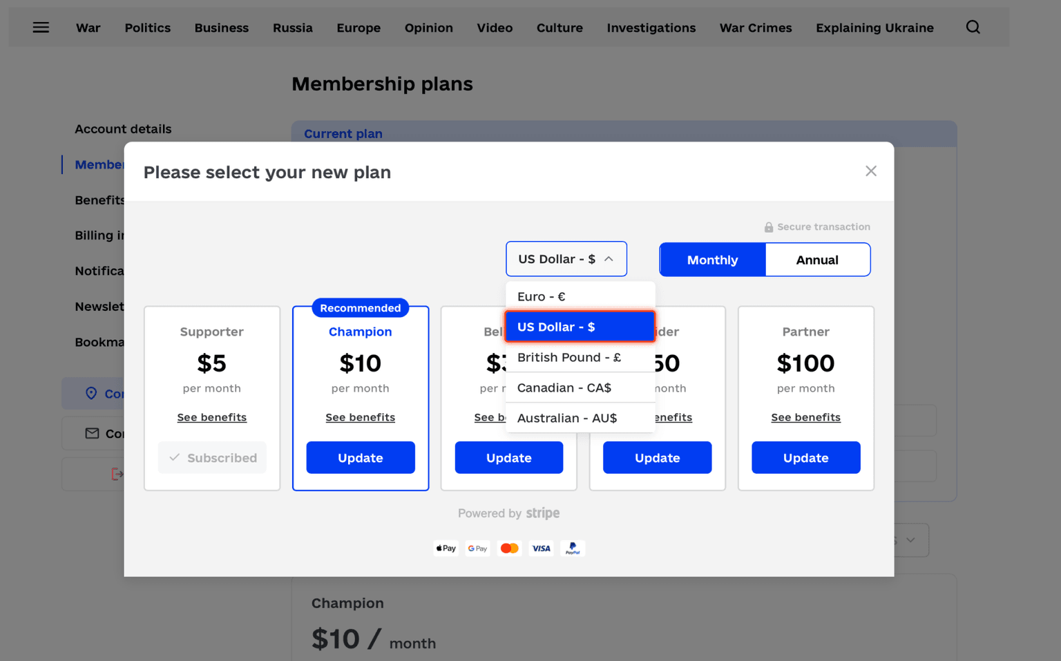 Plan selection modal with the currency dropdown open
