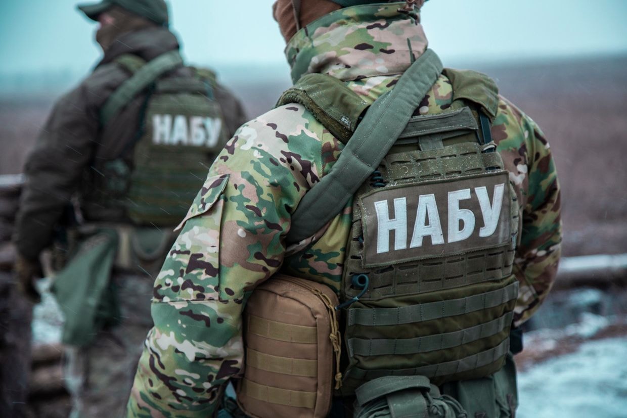 Anti-corruption detective charged with graft as conflict with security service escalates
