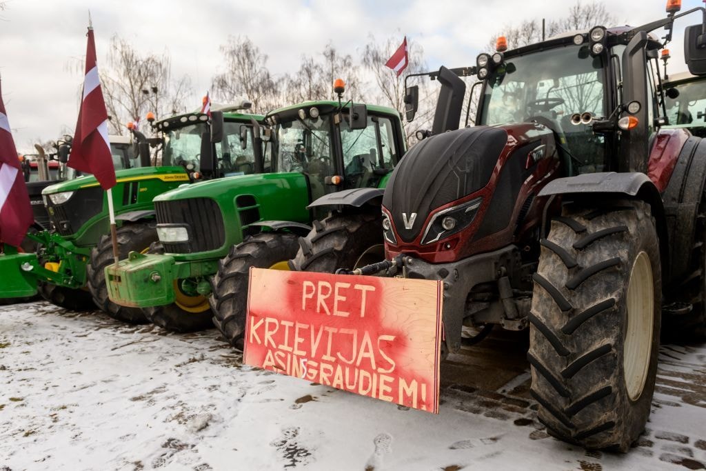 Latvian farmers with signs that read "Against Russian grain products.'"