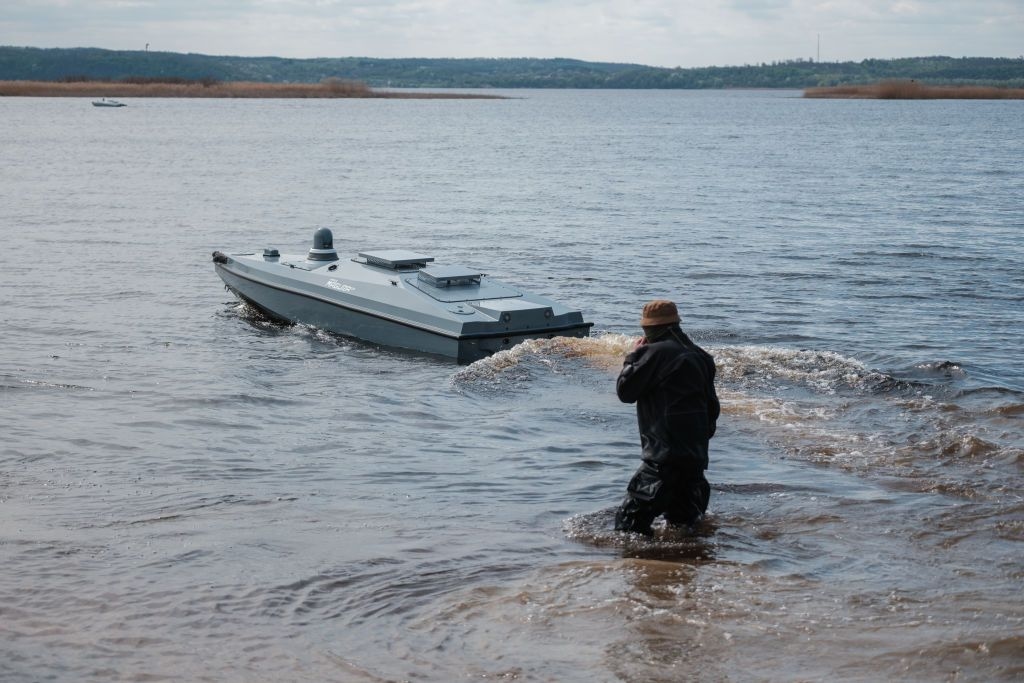 A Ukrainian serviceman of the military intelligence agency launches a naval drone Magura during a demonstration for journalists in an undisclosed location, Ukraine, on April 13, 2024.