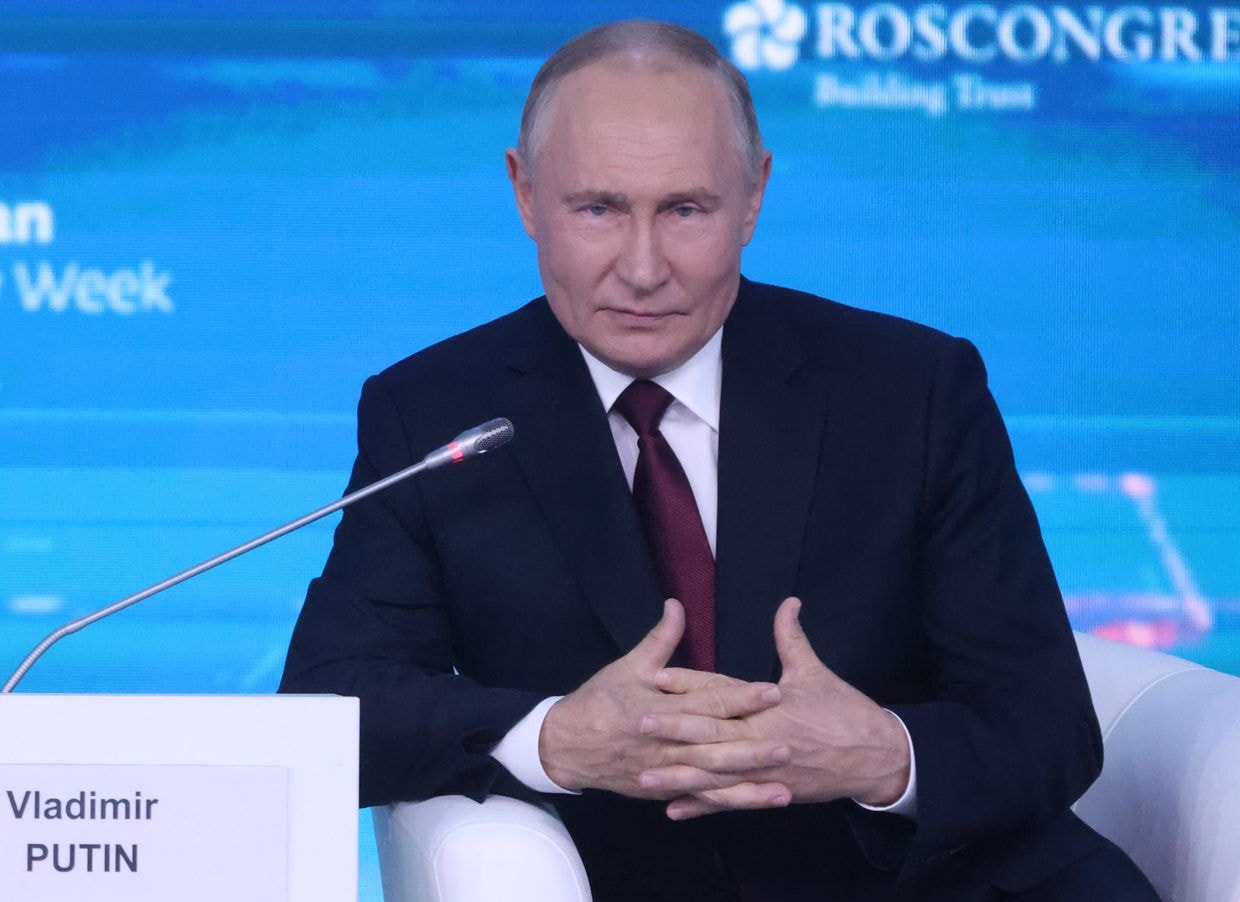 Russian President Vladimir Putin gestures during the plenary session of the Russian Energy Week 2024