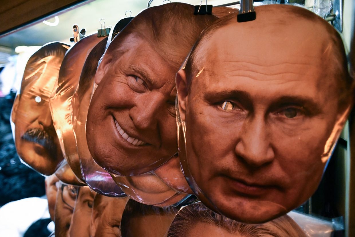 Masks of Russian President Vladimir Putin and former US President and Republican presidential candidate Donald Trump