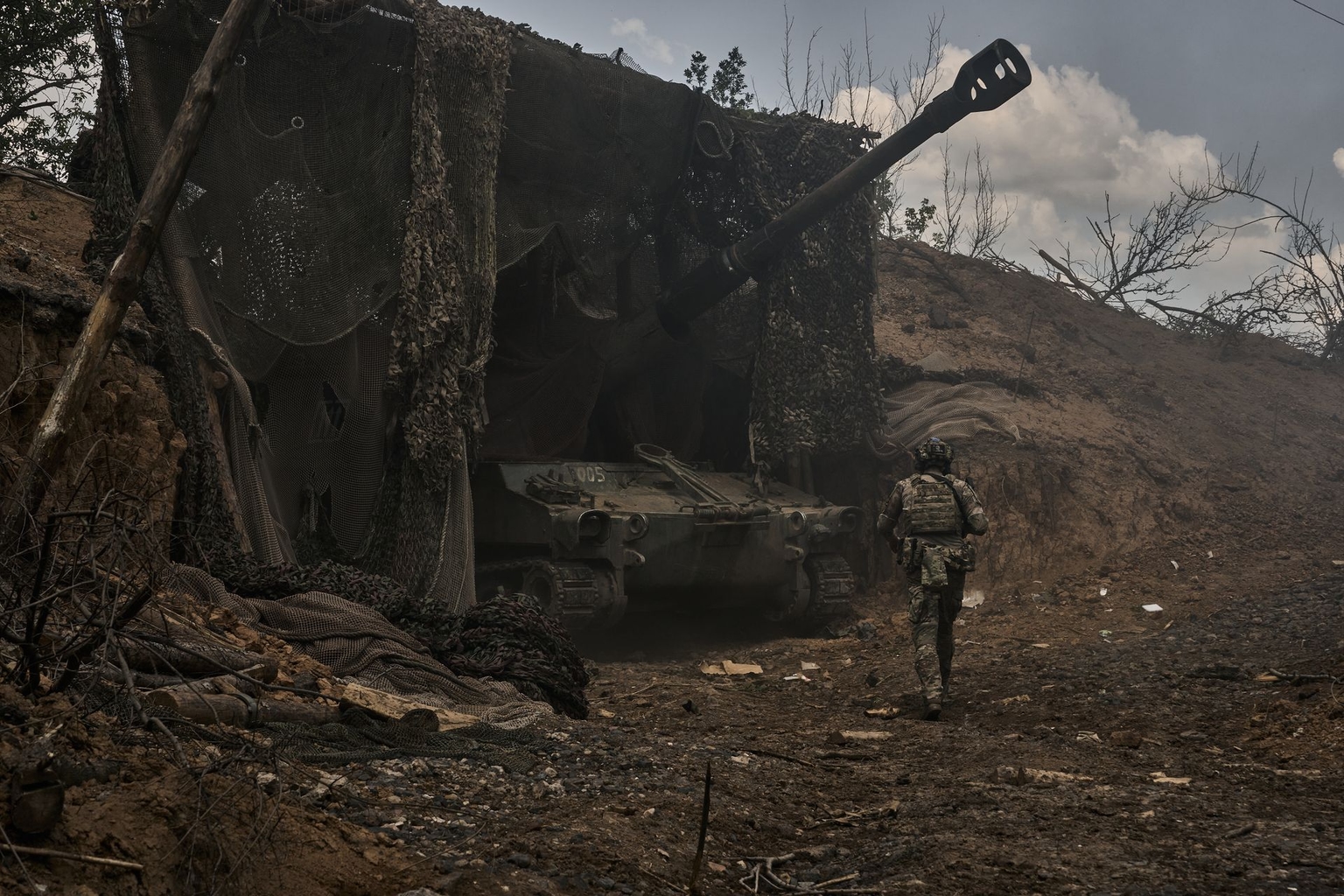A member of an M109 A3 gun crew prepares for combat near Kostiantynivka, Donetsk Oblast, Ukraine, on June 17, 2025.