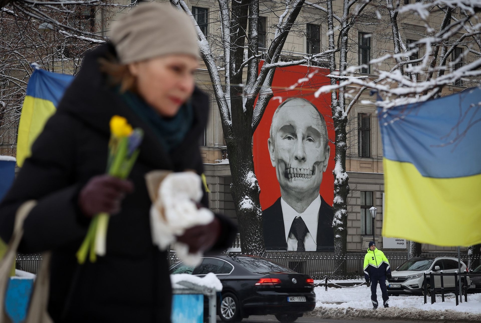 A mural depicting Russian President Vladimir Putin is seen on a building adjacent to the Russian Embassy in Riga, Latvia, on Feb. 24, 2023.