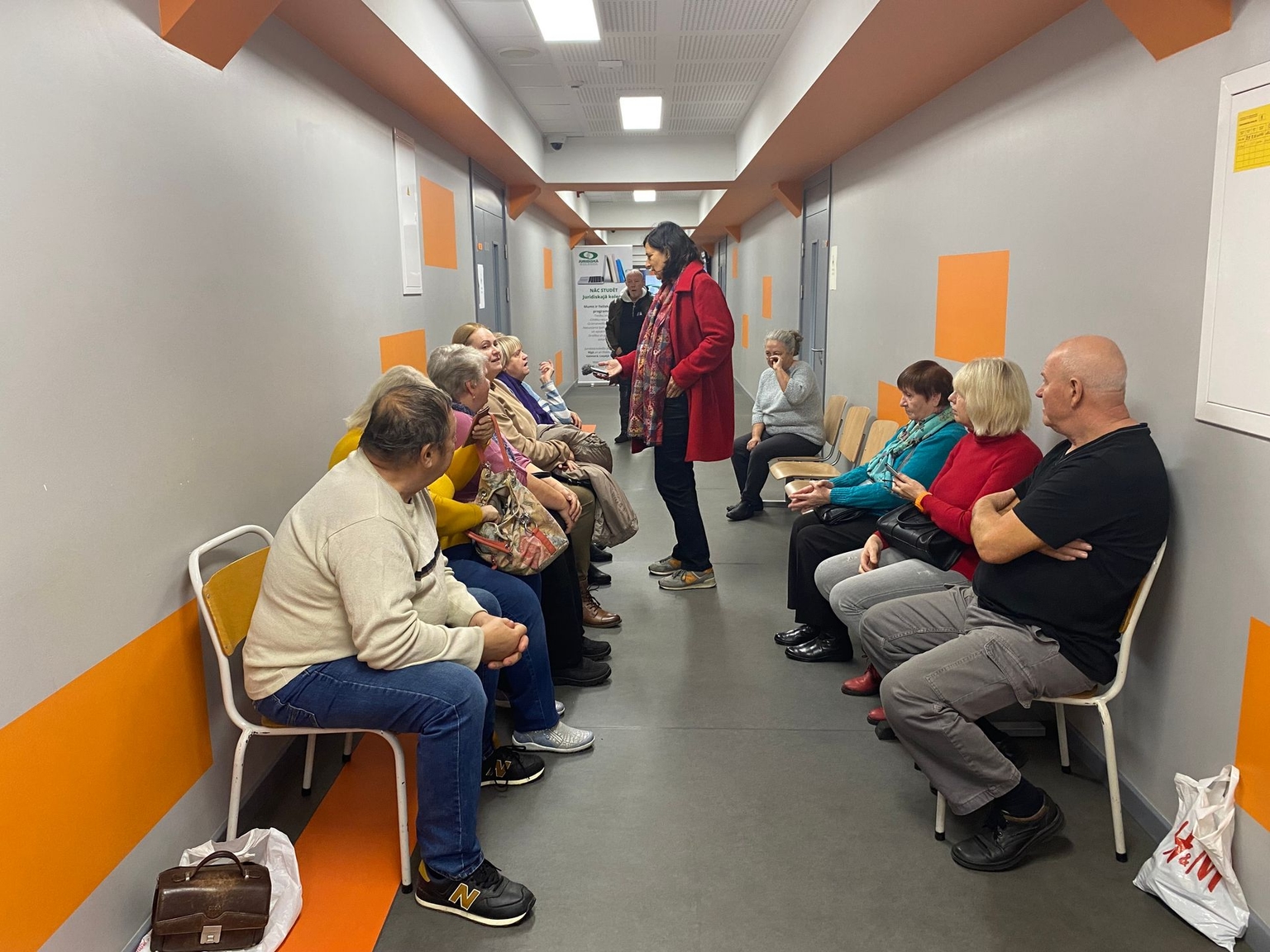 People with Russian passports wait in a public building for their Latvian language exam in Riga, Latvia, on Oct. 23, 2023.