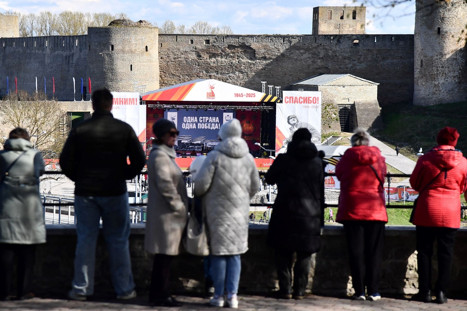 People watch a concert marking the 80th anniversary of Nazi Germany's defeat in World War II, Narva River in Narva, Estonia, on May 9, 2025.