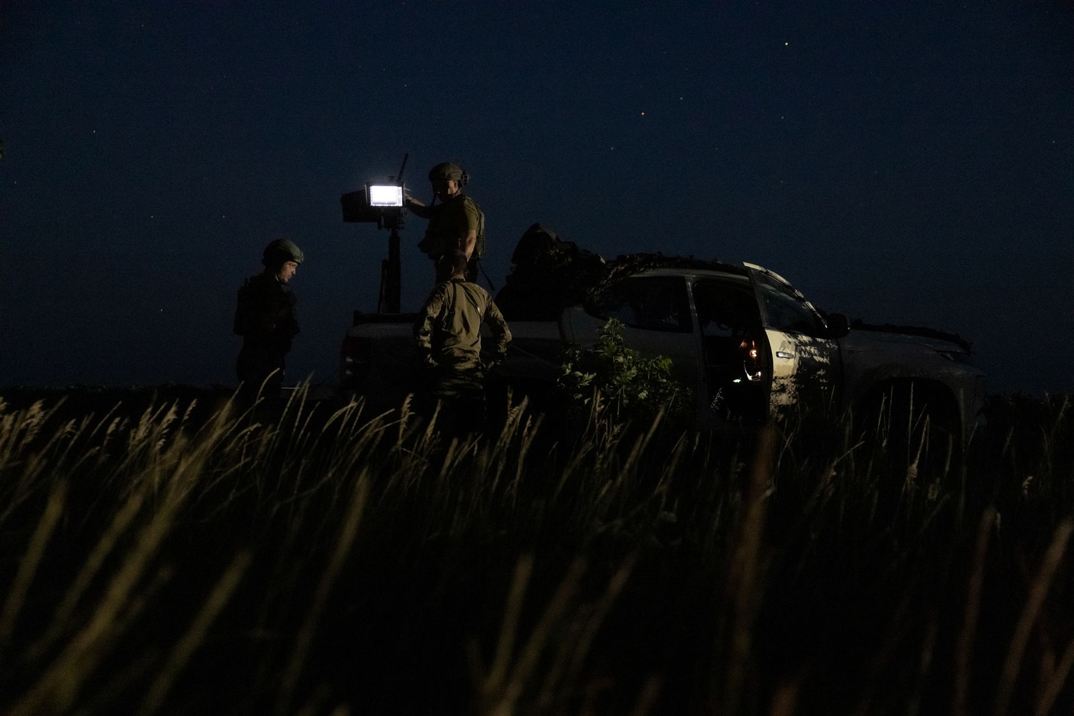 Ukrainian servicemen of the mobile air defense unit of the 641st Separate Anti-Aircraft Machine Gun Battalion wait for potential air threats at a position in Donetsk Oblast, Ukraine, on July 15, 2025.