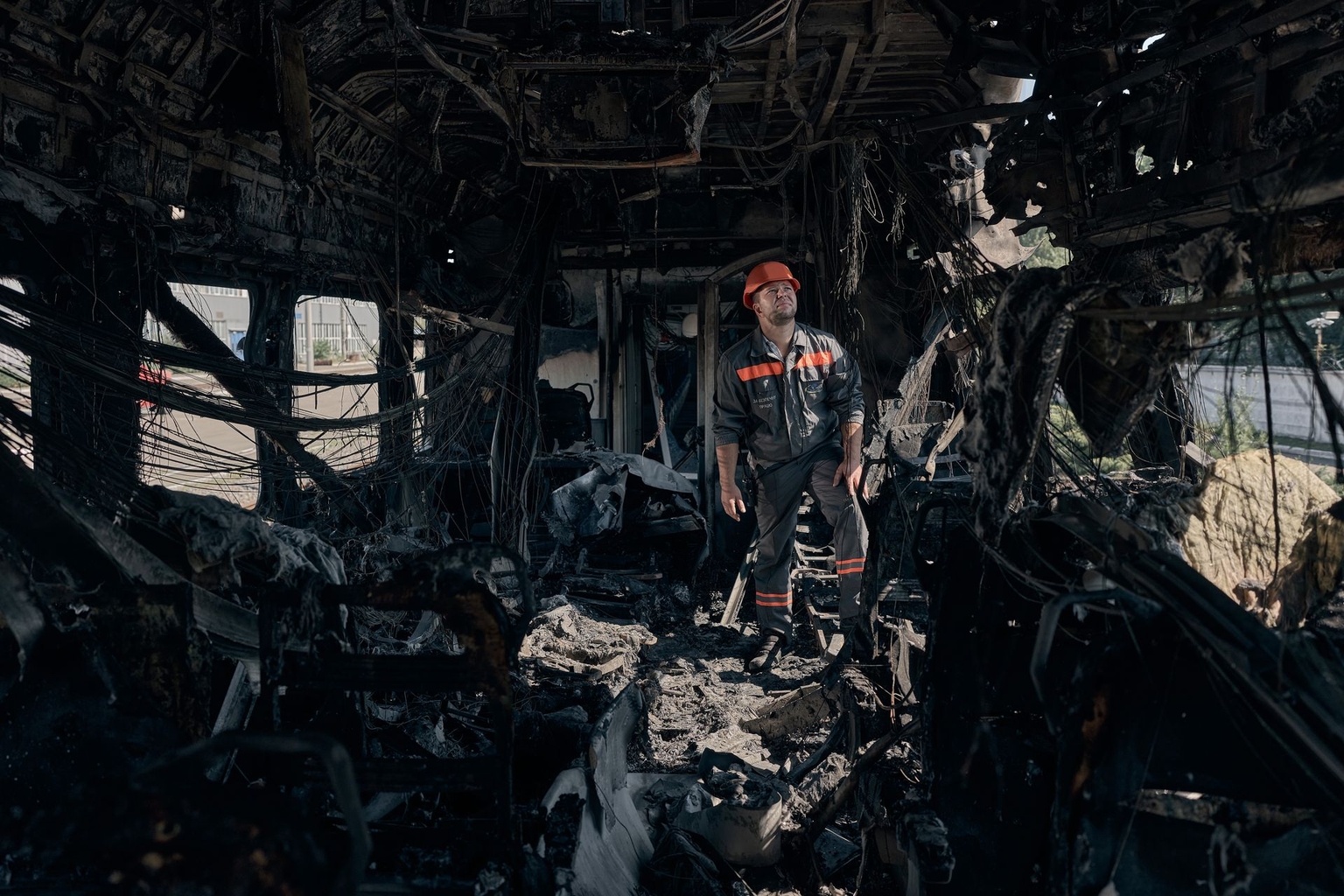 A Ukrainian Railways worker inspects the Kyiv–Kramatorsk passenger train after it was struck by a Russian Shahed-136 drone in Kyiv, Ukraine, on Aug. 28, 2025.