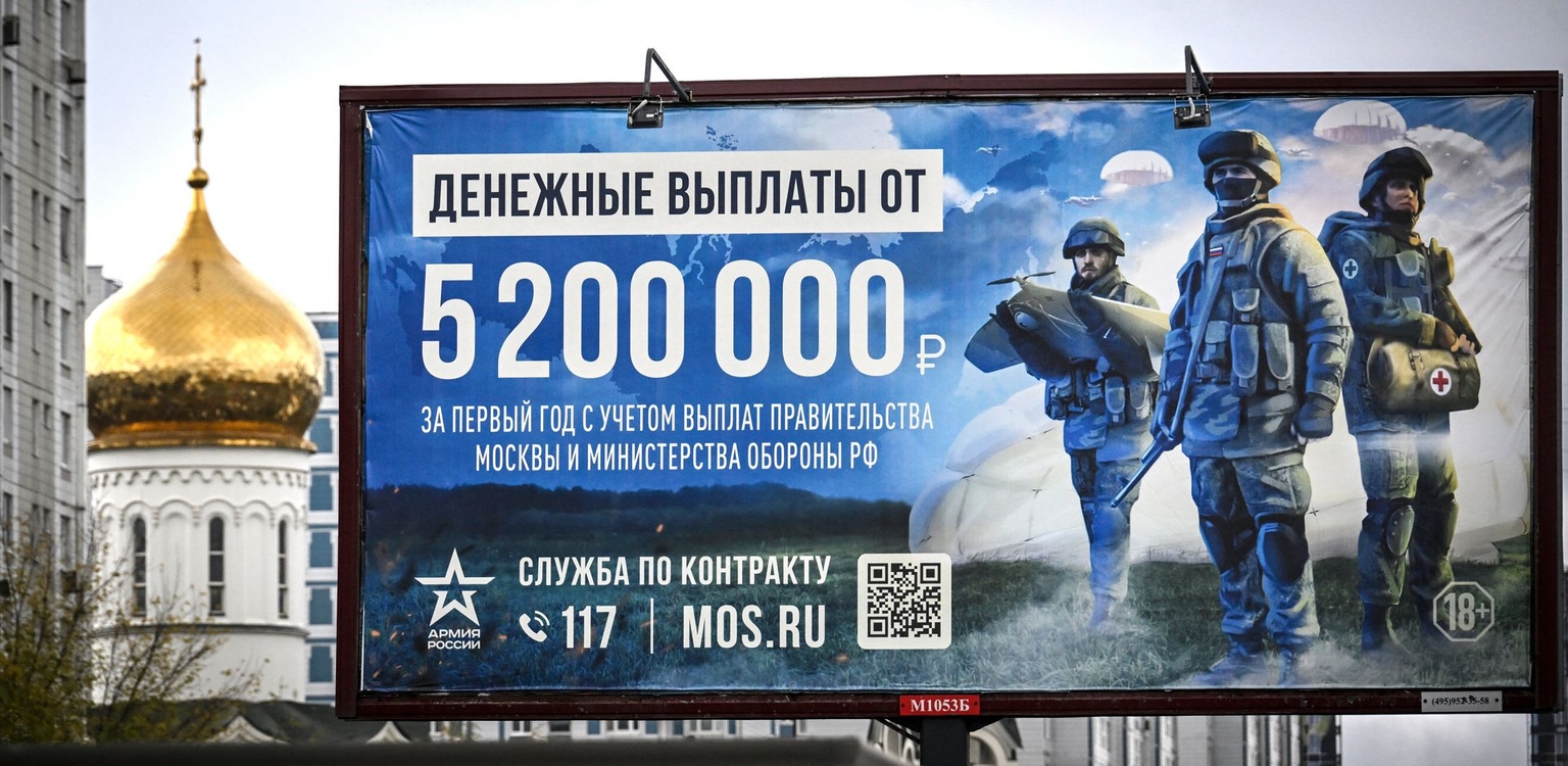 A billboard promoting contract army service and reading “5 200 000 rubles for the first year of the contract” (about USD 64,300) is seen in Moscow, Russia, on Oct. 14, 2025.