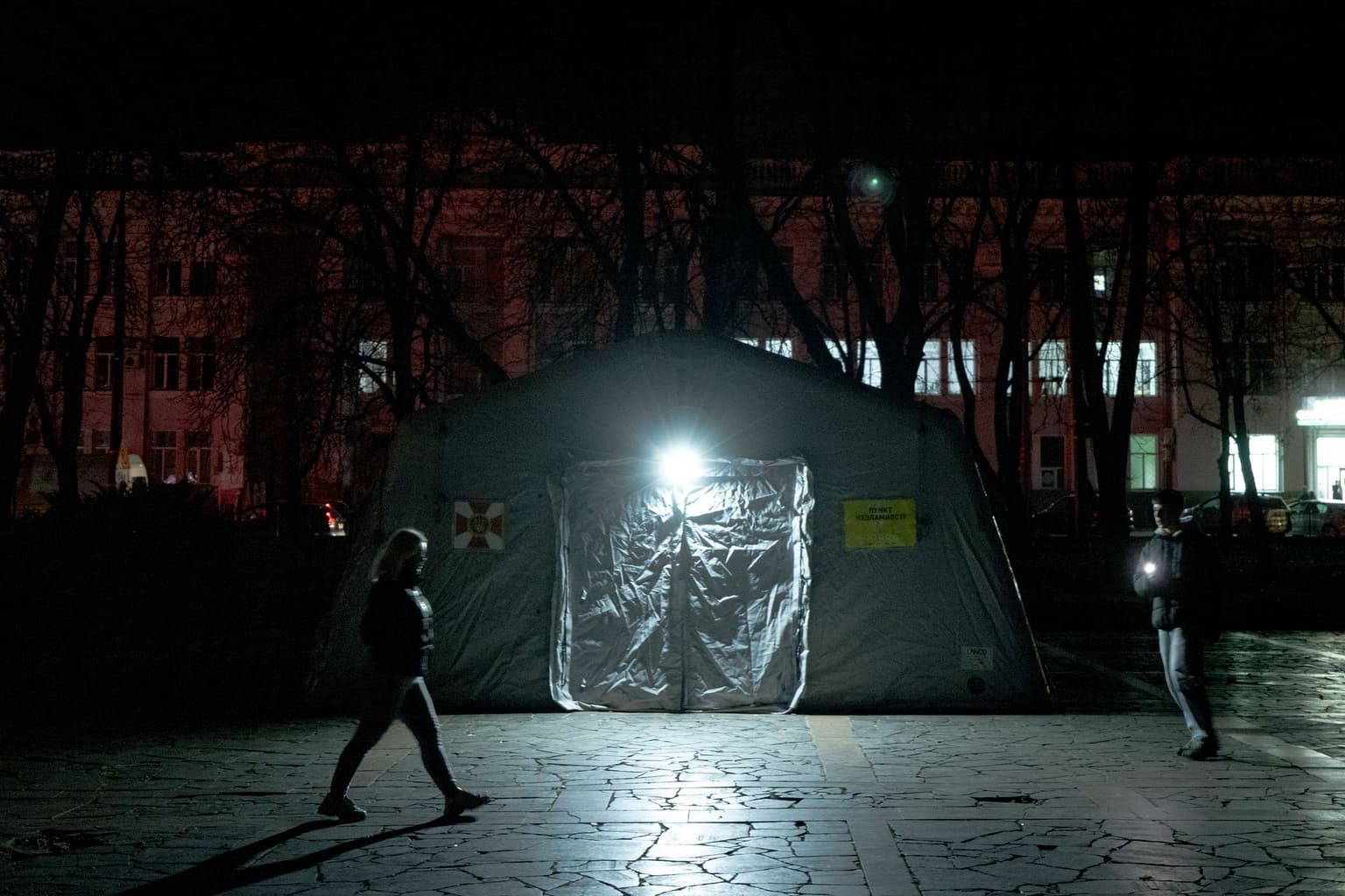 Local residents walk through the city center during a blackout in Chernihiv, Ukraine, on Oct. 10, 2025.