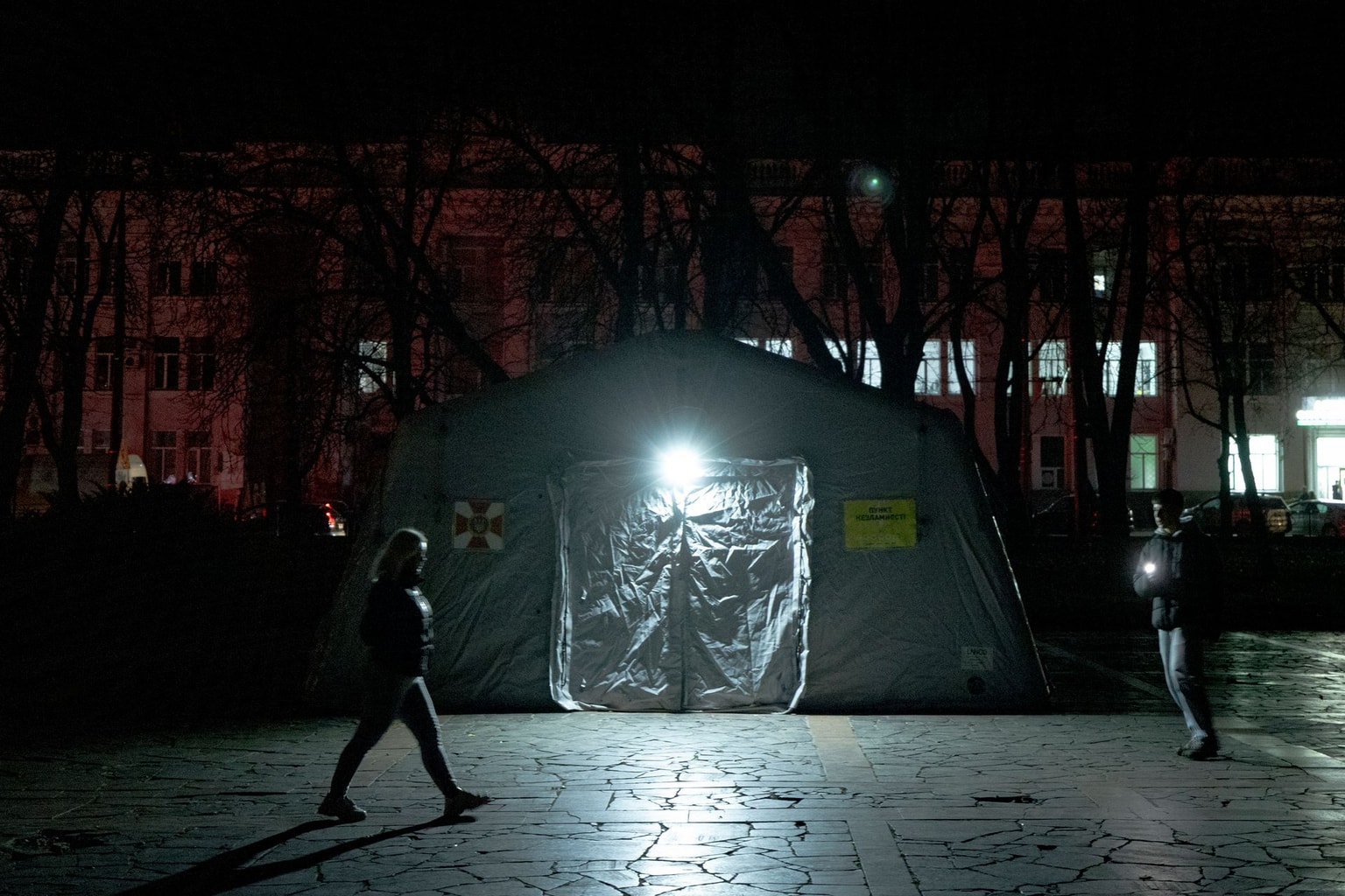 Local residents walk through the city center during a blackout in Chernihiv, Ukraine, on Oct. 10, 2025.