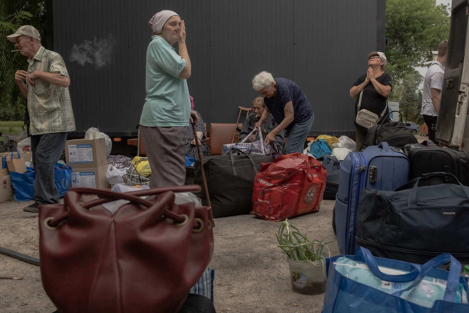 Local residents wait during their evacuation from combat areas at an evacuation center in Pavlohrad, Dnipropetrovsk Oblast, Ukraine, on July 18, 2025, amid the Russian invasion.