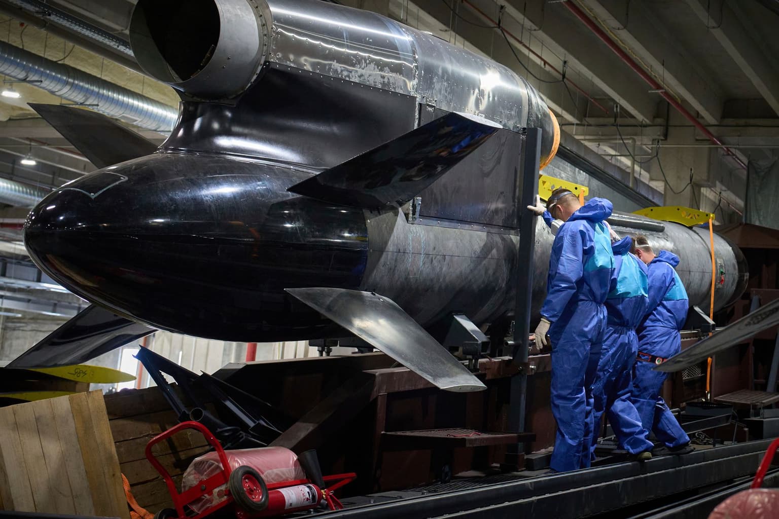 Workers inspect a Flamingo cruise missile at Fire Point’s secret factory in Ukraine on Aug. 18, 2025.