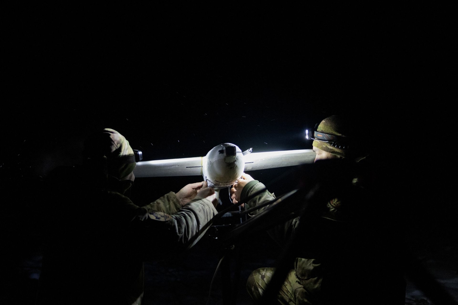 Ukrainian servicemen of the 18th Sloviansk Brigade of the National Guard of Ukraine prepare to launch a drone interceptor in Donetsk Oblast, Ukraine, on Jan. 22, 2026.