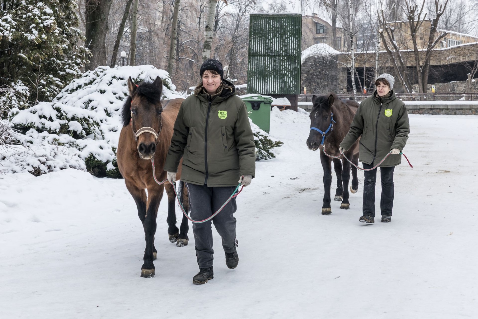 Zoo workers walk with Hutsul horses at the Kyiv Zoo in Kyiv, Ukraine, on Jan. 27, 2026.