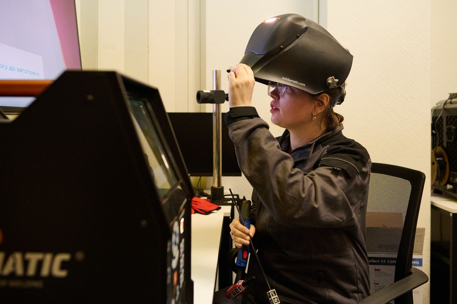 A KSE ProfTech instructor sets up a welding simulator before the students' training session at the KSE ProfTech facility in Kyiv, Ukraine, on Feb. 25, 2026.