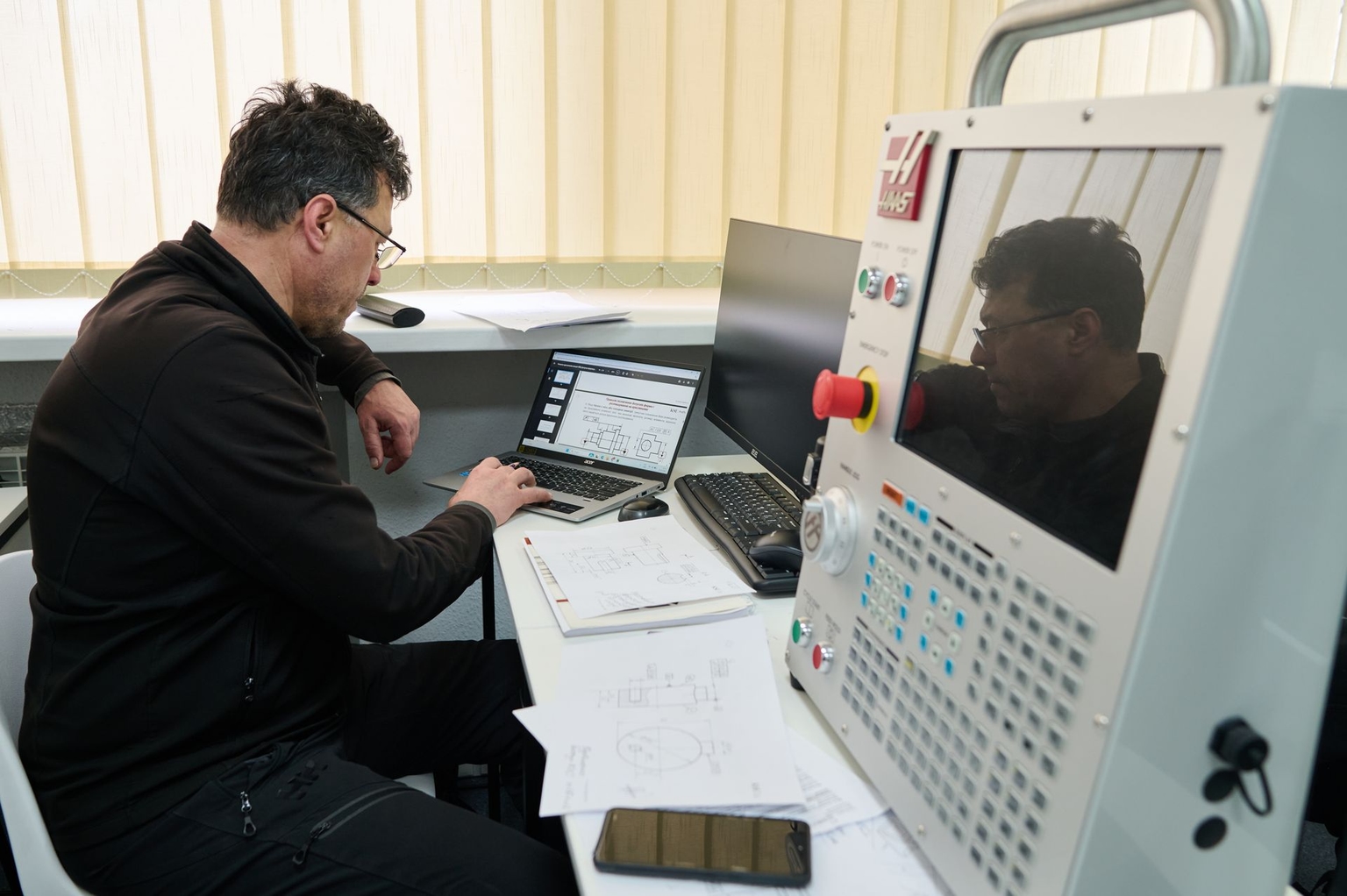KSE ProfTech students train in a classroom equipped with machine control units (MCUs) for CNC machines at the KSE ProfTech facility in Kyiv, Ukraine, on Feb. 25, 2026.