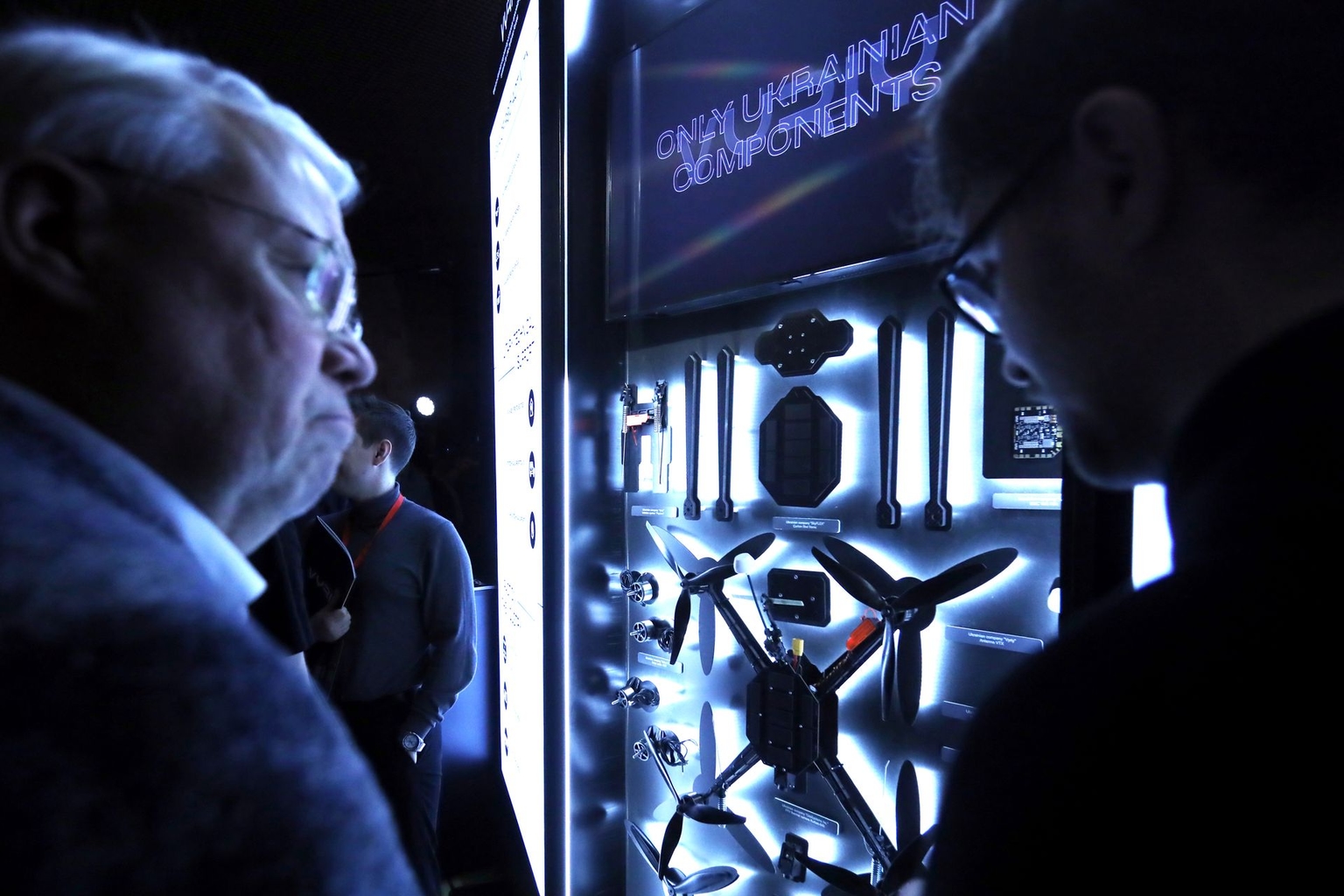 People look at drone parts at the Brave1 Components event in Kyiv, Ukraine, on December 3, 2025.