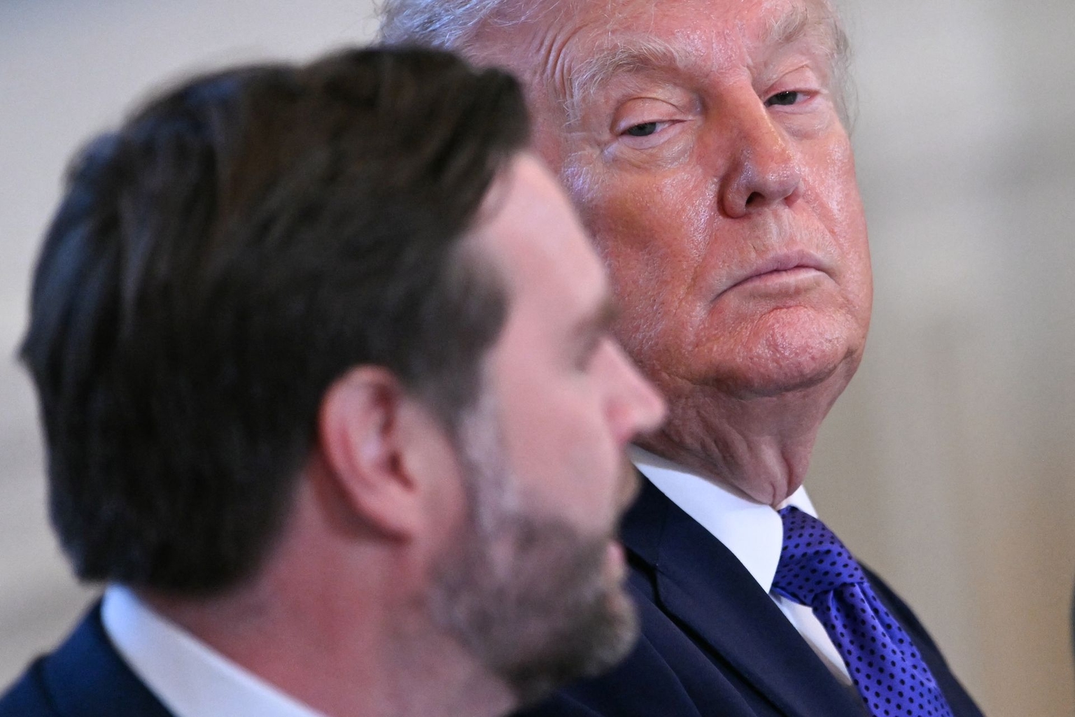 U.S. President Donald Trump (R) looks at Vice President JD Vance (L) in Washington, D.C., U.S. on Jan. 9, 2026.
