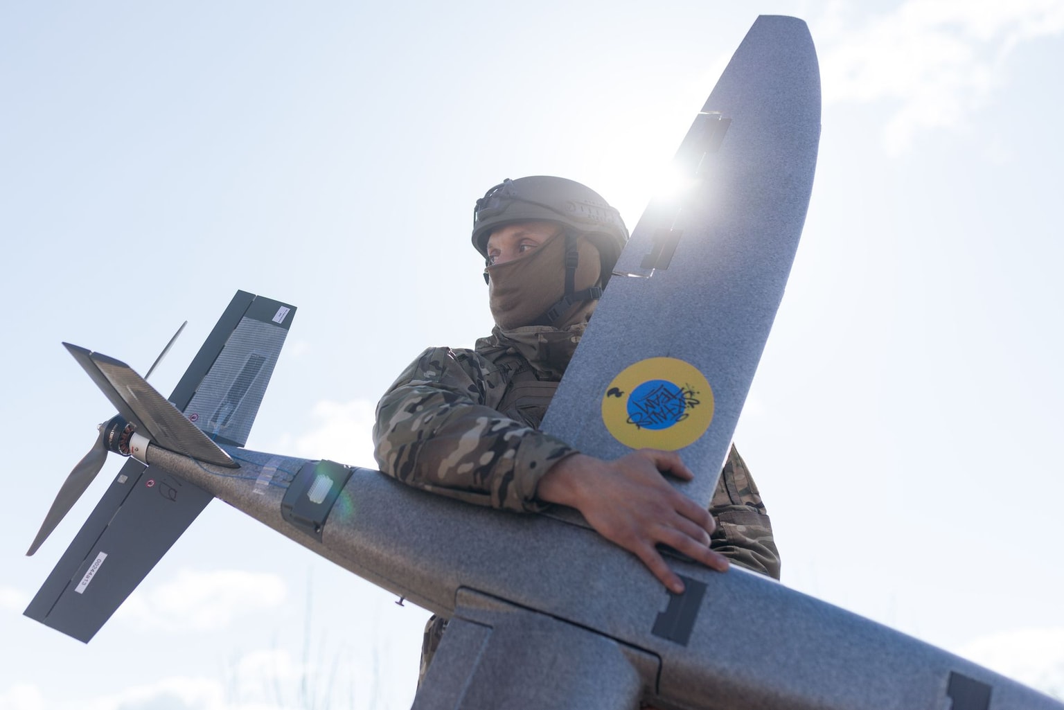 Ukrainian soldier holds a "Marsianin" attack drone in Kharkiv region, Ukraine, on April 7, 2026.