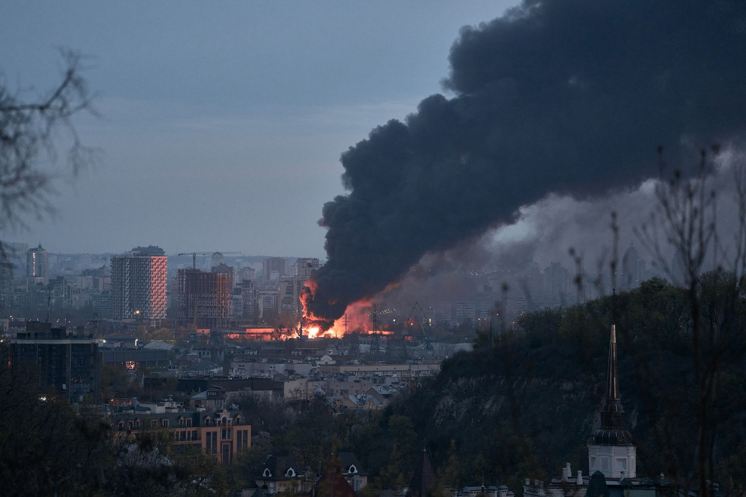 A large fire burns at a secondary raw materials facility following an overnight Russian missile strike in Kyiv, Ukraine, on April 16, 2026.