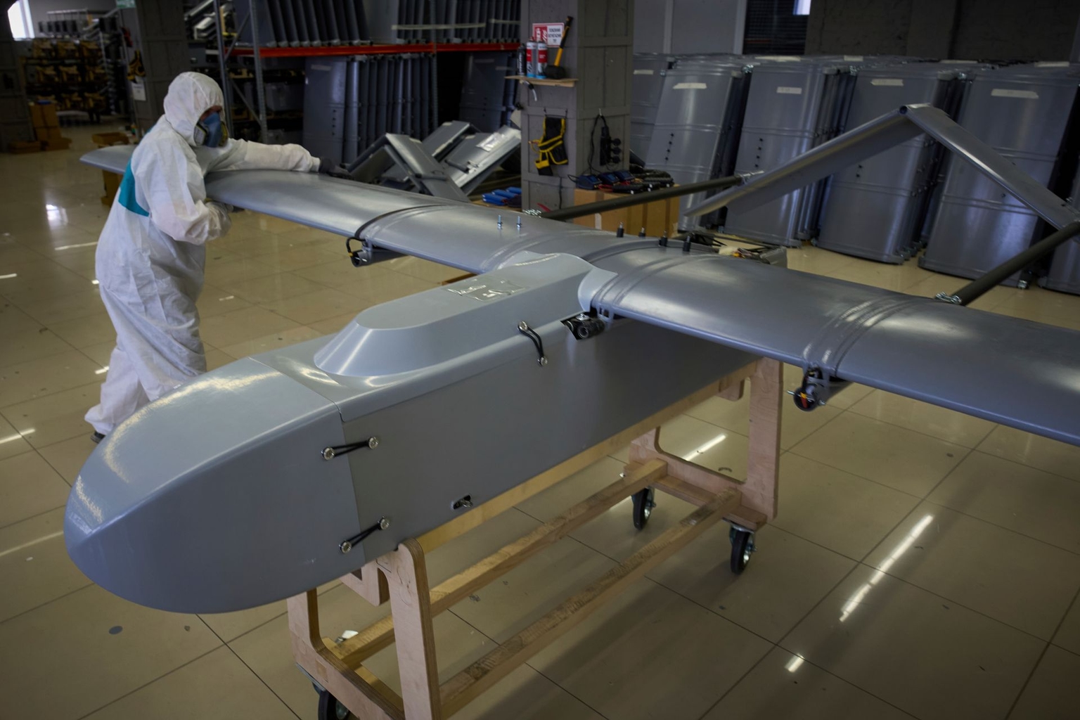 A worker inspects a combat drone at Fire Point's secret factory in Ukraine on Aug. 18, 2025.