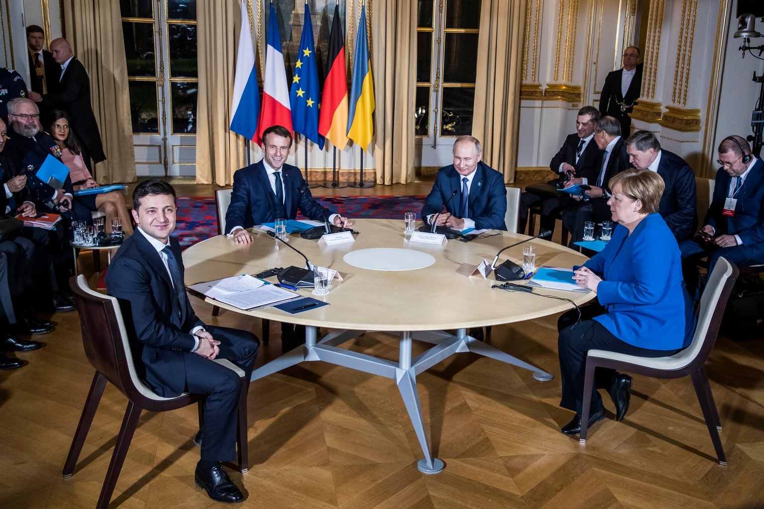 President Volodymyr Zelensky, French President Emmanuel Macron, Russian President Vladimir Putin and then-German Chancellor Angela Merkel attend their summit on Ukraine at the Elysee Palace in Paris, France, on Dec. 9, 2019.